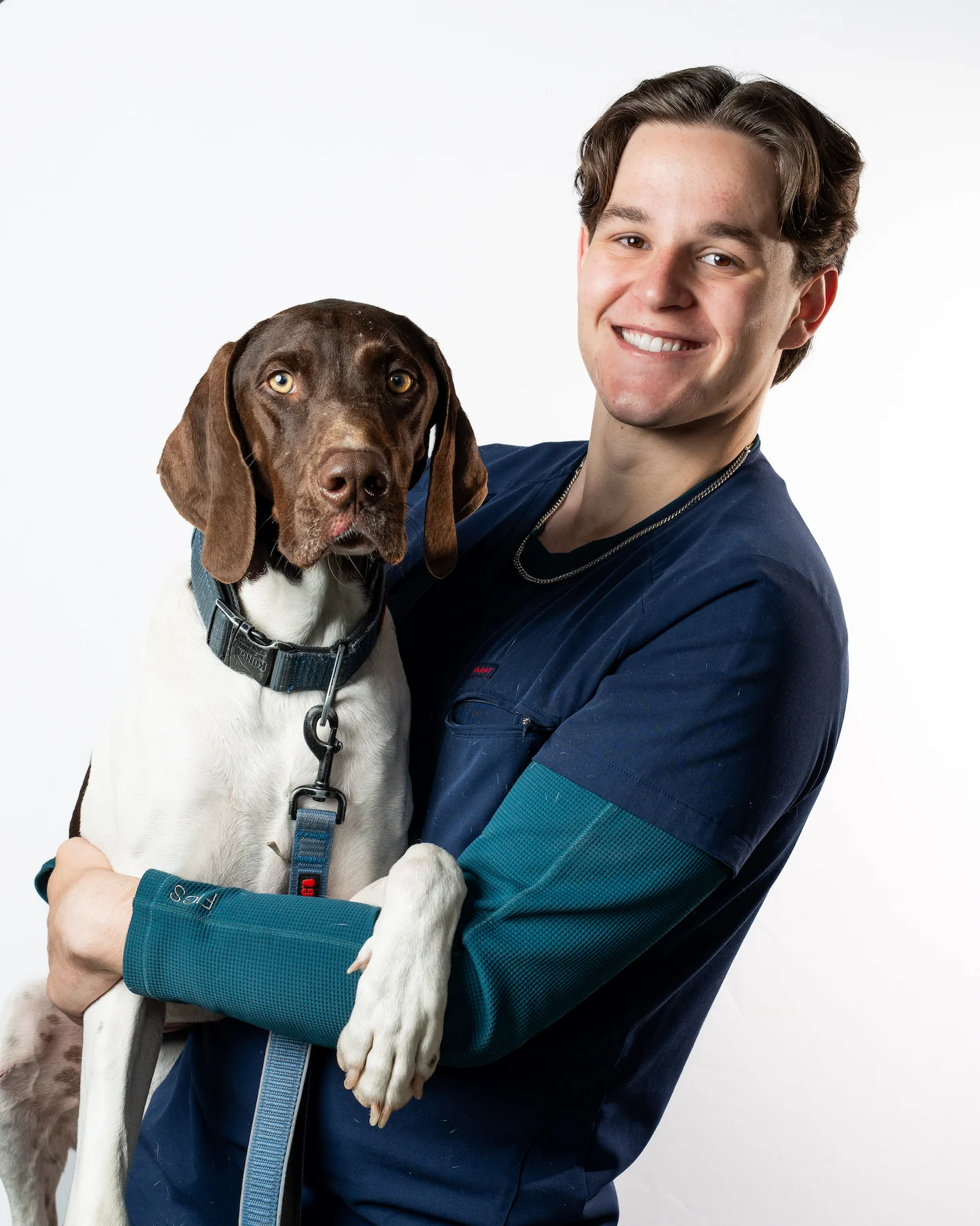 Riverpark Pet Hospital team member with a German Shorthaired Pointer