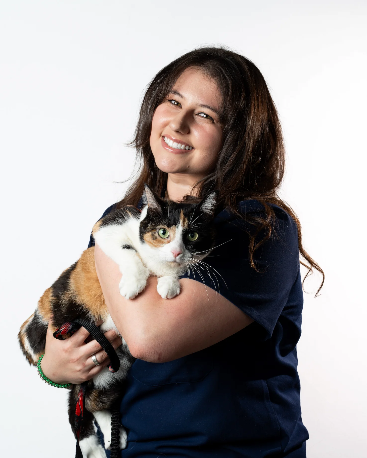 Riverpark Pet Hospital team member with a calico cat