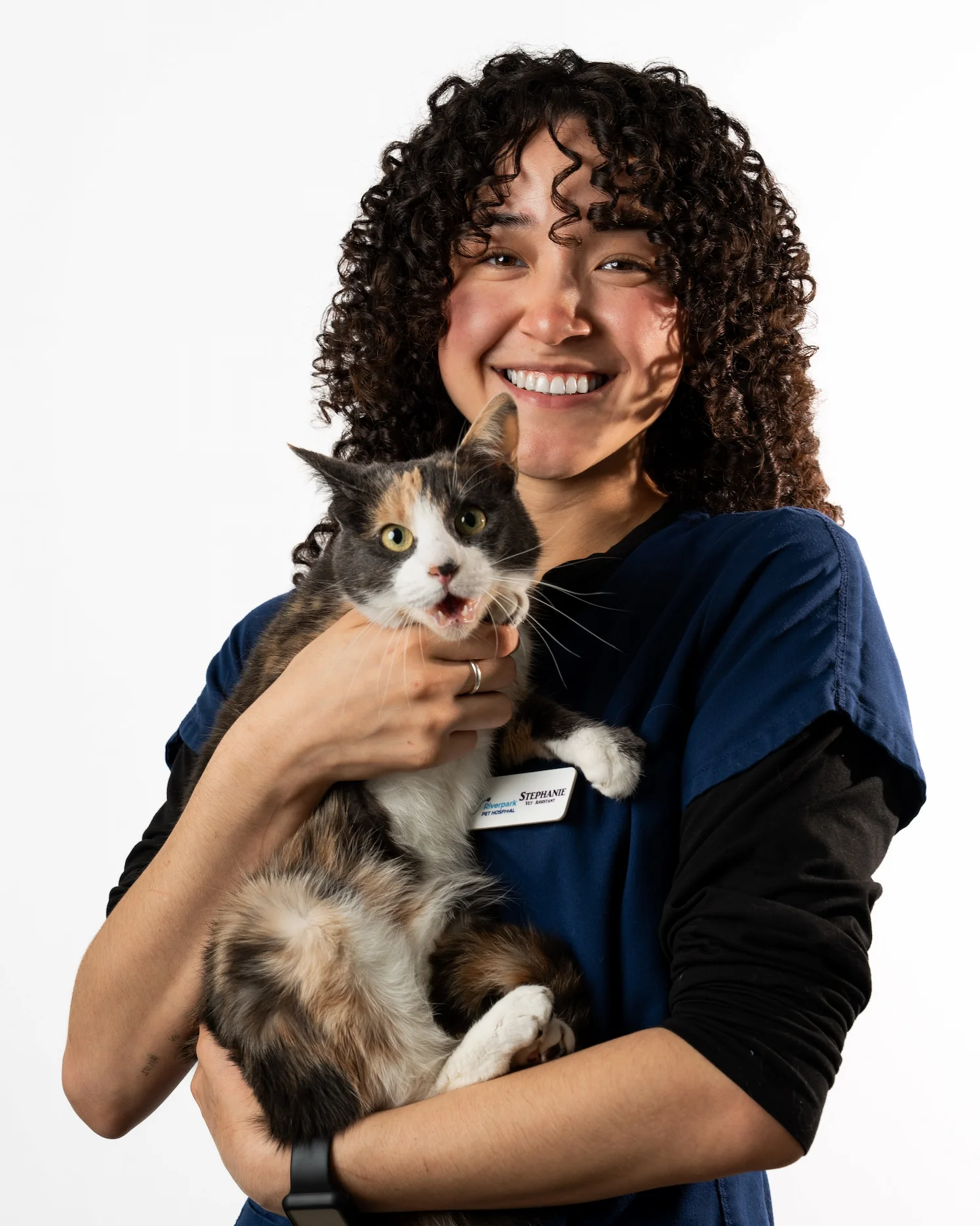 Riverpark Pet Hospital vet assistant Stephanie with a calico cat